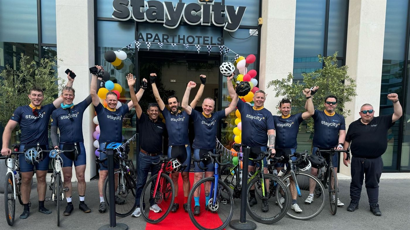 Staycity colleagues with bikes outside a Staycity aparthotel